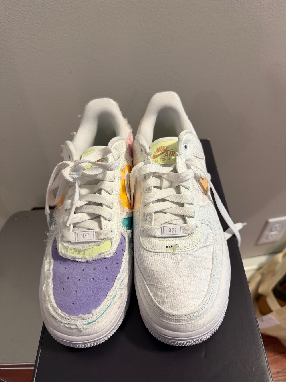 Nike White Low-Top Sneakers with Purple, Yellow, Teal & Pink Accents